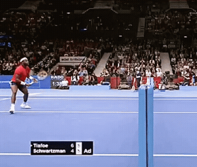 A Tennis Match Between Tiafoe And Schwartzman Is In Progress GIF