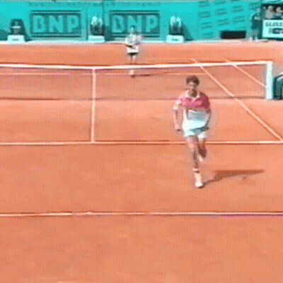 A Tennis Match Is Being Played In Front Of A Bnp Sign GIF