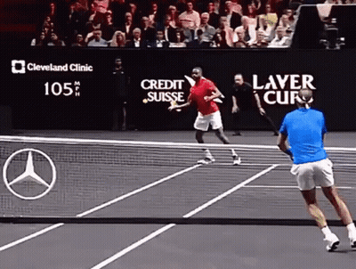 A Tennis Match Is Being Played In Front Of A Large Screen That Says Cleveland Clinic GIF