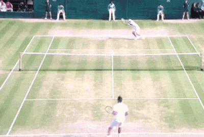 A Tennis Match Is Being Played On A Court GIF