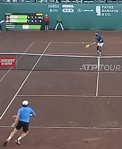 A Tennis Match Is Being Played On A Court With Emirates Airlines Advertisements On The Wall GIF