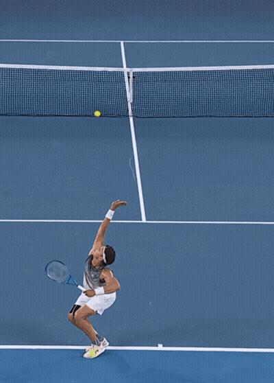A Tennis Player Is About To Hit A Ball On A Court With A Ktm Logo On The Net GIF