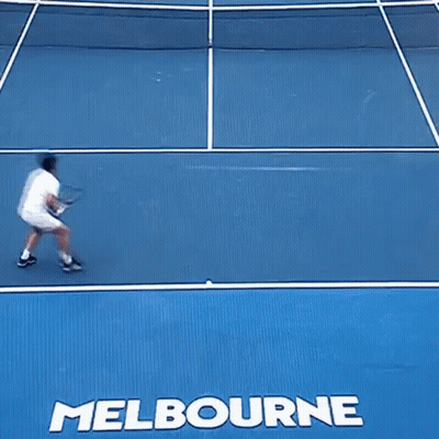 A Tennis Player Is Falling On A Court With The Word Melbourne On It GIF