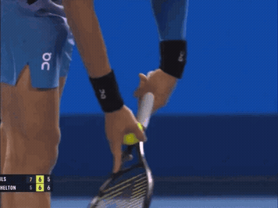 A Tennis Player Is Holding A Tennis Racquet In Front Of A Scoreboard That Says Hills 7 6 5 6 6 GIF