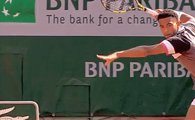 A Tennis Player Is Playing In Front Of A Bnp Pariba Sign GIF