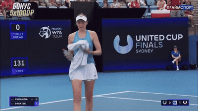 A Tennis Player Is Walking On A Court In Front Of A United Cup Finals Sign GIF