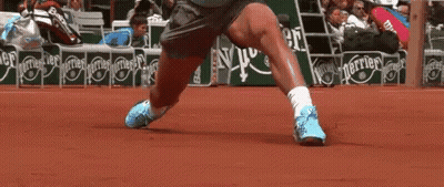 A Tennis Player 'S Legs Are Shown In Front Of A Perrier Advertisement GIF