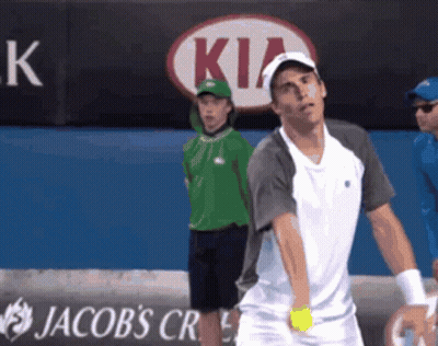 A Tennis Player Stands In Front Of A Kia Ad GIF