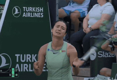 A Tennis Player Stands In Front Of A Turkish Airlines Sign GIF