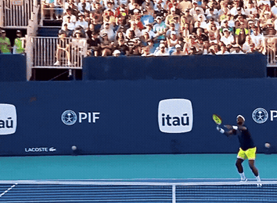 A Tennis Player Swings A Racquet In Front Of A Wall That Has Itau Written On It GIF