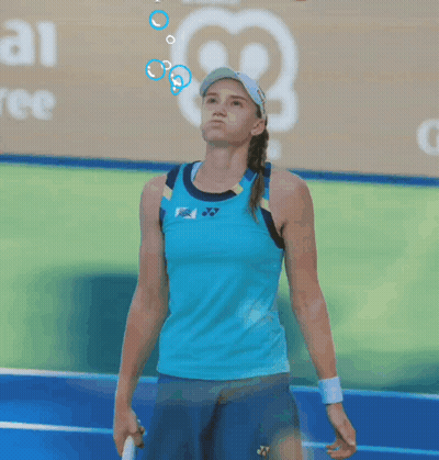 A Tennis Player Wearing A Blue Tank Top And Blue Shorts GIF