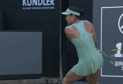 A Tennis Player Wearing A Green Tank Top With Bpi Written On It GIF