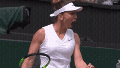 A Tennis Player Wearing A Nike Visor Is Holding A Tennis Racquet GIF