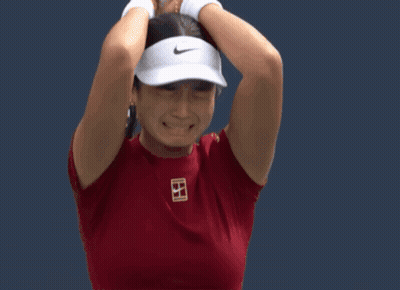 A Tennis Player Wearing A Red Shirt With The Letter B On The Front GIF