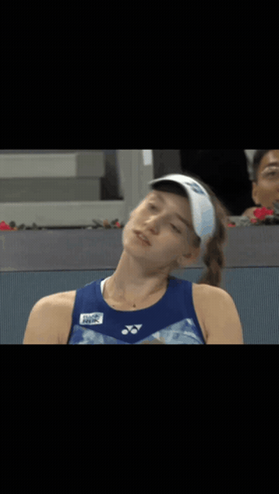 A Tennis Player Wearing A Yonex Visor Looks At Something GIF