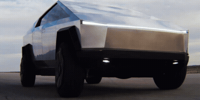 A Tesla Cybertruck Is Parked In The Desert GIF