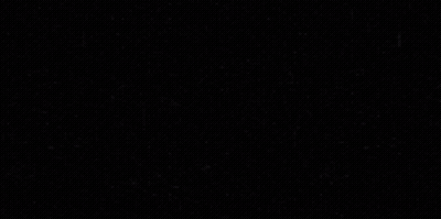 A Tesla Model 3 Is Parked In A Dark Room GIF