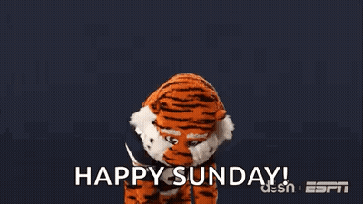 A Tiger Mascot Is Standing In Front Of A Blue Background With The Words `` Happy Sunday '' . GIF