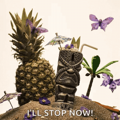 A Tiki Statue Sits On A Sandy Beach Surrounded By Pineapples Palm Trees And Purple Flowers GIF