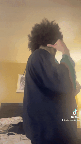 A Tiktok Video Of A Man Covering His Face GIF