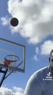 A Tiktok Video Of A Man Playing Basketball With A Basketball In The Air GIF
