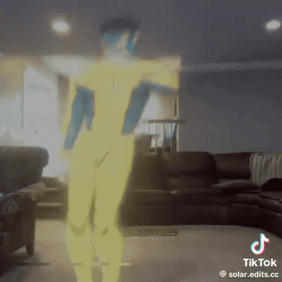 A Tiktok Video Of A Person Dancing In A Living Room With A Couch In The Background GIF
