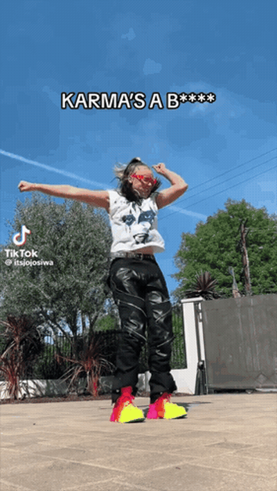 A Tiktok Video Of A Woman Dancing With The Caption Karma 'S A B GIF