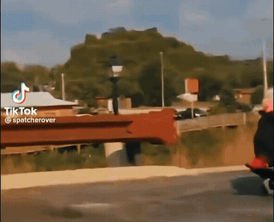 A Tiktok Video Shows A Person Riding A Bike On A Bridge GIF
