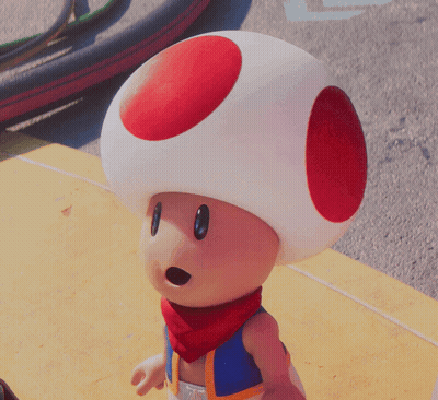 A Toad With A Red Circle On His Head And A Scarf Around His Neck GIF