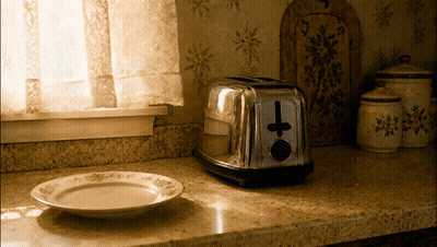 A Toaster With A Cross On It Sits On A Counter GIF