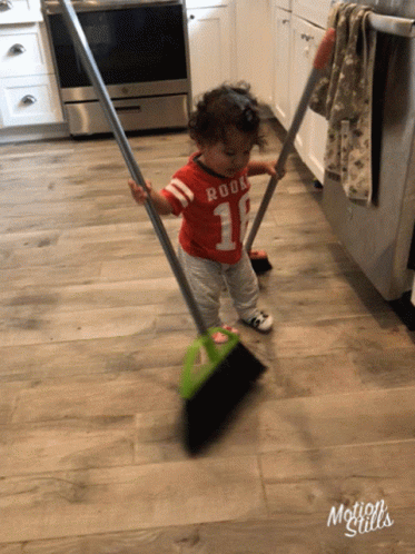 A Toddler Wearing A Red Shirt With The Number 10 On It GIF