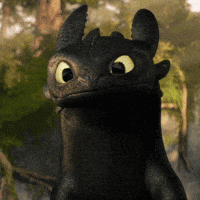 A Toothless From How To Train Your Dragon Is Looking At The Camera GIF