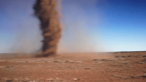 A Tornado In The Desert With A Blue Sky GIF