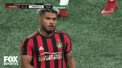 A Toronto Fc Soccer Player Stands On The Field GIF