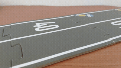 A Toy Car Is Driving On A Road With The Number 40 On It GIF