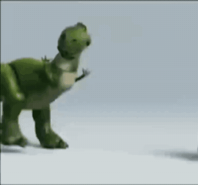 A Toy Dinosaur From The Movie Toy Story Is Walking On A White Surface . GIF