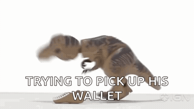 A Toy Dinosaur Is Trying To Pick Up A Wallet . GIF