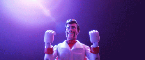 A Toy Figure With His Fist In The Air And A Beard GIF