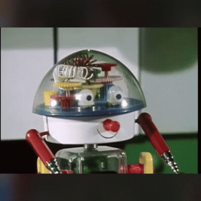 A Toy Robot With A Clear Dome On Top Of It 'S Head GIF