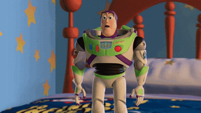 A Toy Story Character Named Buzz Lightyear Standing On A Bed GIF