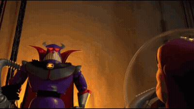 A Toy Story Character Named Buzz Lightyear Stands Next To A Purple Robot GIF