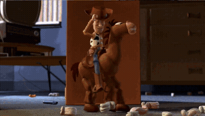 A Toy Story Character Riding A Brown Horse GIF