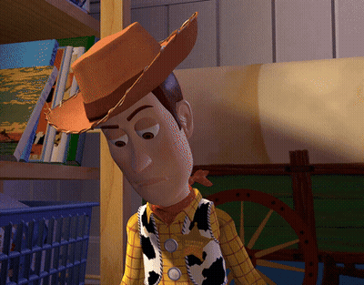 A Toy Story Character Wearing A Cowboy Hat And A Plaid Shirt GIF