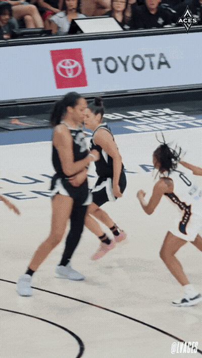 A Toyota Ad Is Behind A Basketball Game GIF
