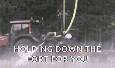 A Tractor Is Holding Down The Fort For You . GIF