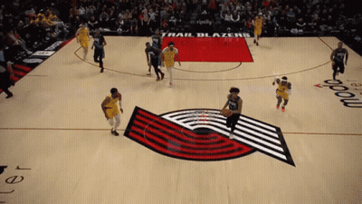 A Trail Blazers Basketball Game Is Being Played On A Basketball Court GIF