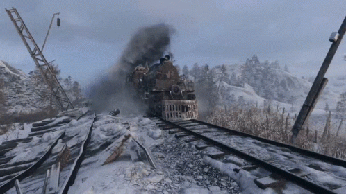 A Train Is Going Down A Snowy Track With Smoke Coming Out Of It GIF