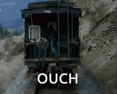 A Train Is Going Down The Tracks And The Word Ouch Is On The Screen GIF
