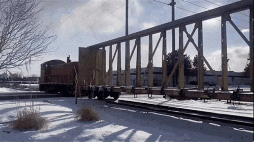 A Train Is Going Over A Bridge With The Letters X And Y Visible GIF
