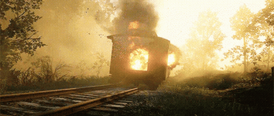 A Train Is On Fire On The Tracks With Smoke Coming Out Of It GIF